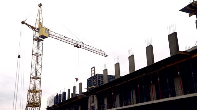 The-construction-site-has-workers-and-a-construction-crane