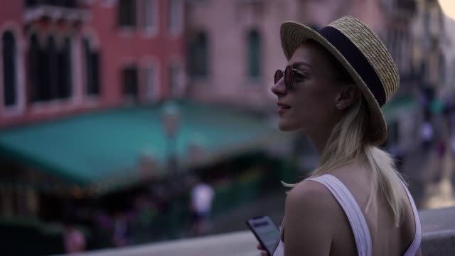Slow-motion-effect-of-attractive-caucasian-female-traveller-enjoying-time-for-exploring-italian-city-walking-on-urban-setting