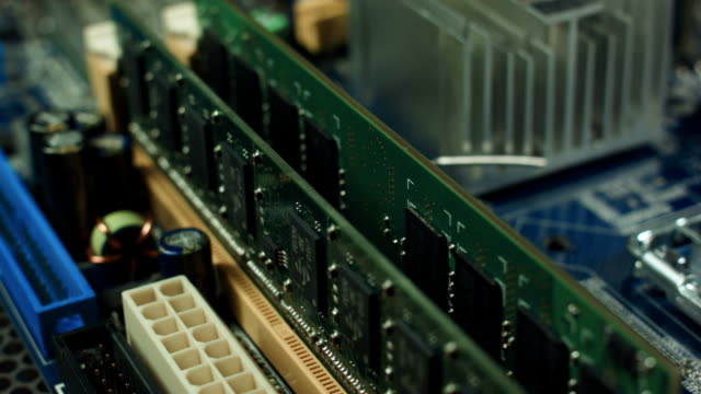 motherboard-with-RAM-spinning-on-the-stand,-slot-for-memory-closeup