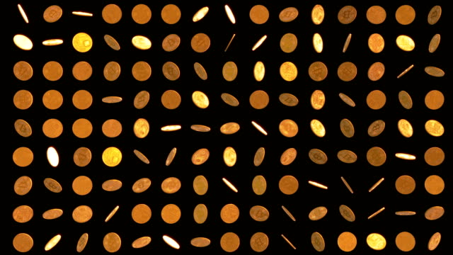 Set-of-rotating-golden-bitcoin-on-black-background.
