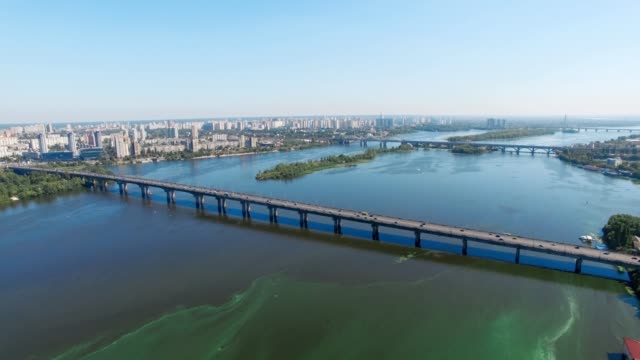 Kiev,-Ukraine.-Aerial-view-of-Road-bridge---Moscow-Bridge-over-Dnieper-river.-Sunset-in-Kyiv,-Eastern-Europe