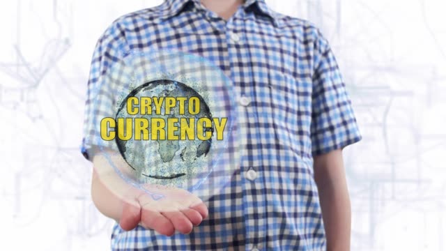 Young-man-shows-a-hologram-of-the-planet-Earth-and-text-Cryptocurrency