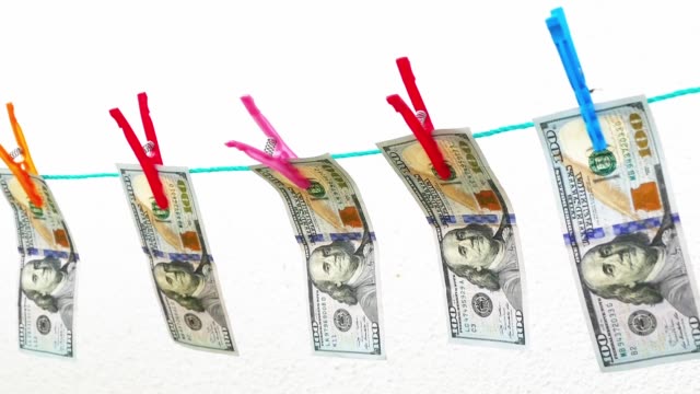usa-dollars-lined-up-with-pegs,
