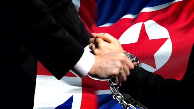 Great-Britain-Sanktionen-Nordkorea-angekettet-Arme,-politischen-oder-wirtschaftlichen-Konflikt