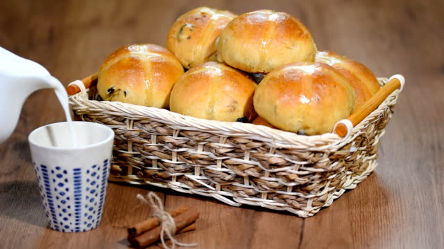 Easter-Hot-Cross-Buns-in-a-Basket.-Pour-milk-into-a-Cup.