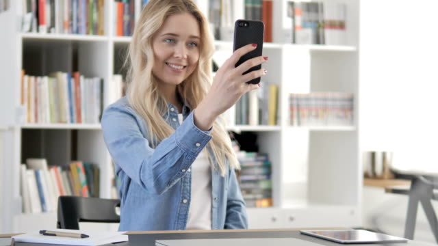 Young-Girl-Taking-Selfie-with-Smartphone,-Photograph