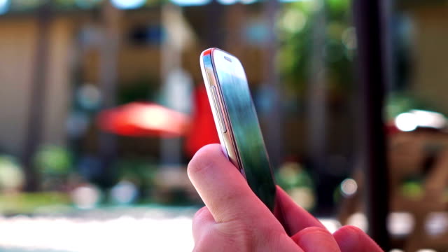 Woman-using-phone-on-the-vacations-in-slow-motion-120fps