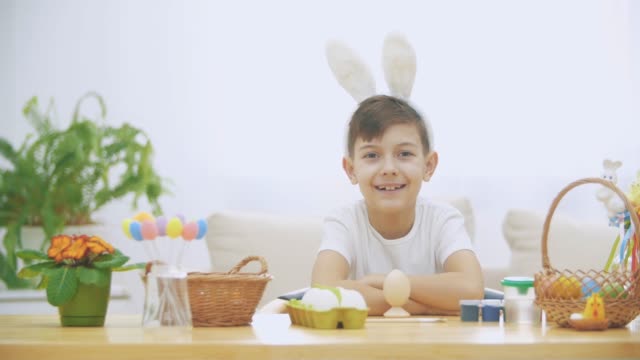 Little-cute-and-adorable-boy-is-smiling-sincerely.-Boy-is-pumping-over.-Concept-Easter-holiday.