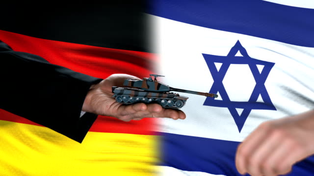 Germany-and-Israel-officials-exchanging-tank-for-money,-flag-background,-deal