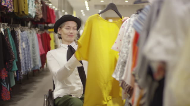 Woman-in-Wheelchair-Taking-Photo-of-Blouse-at-Store
