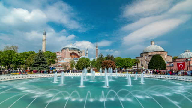 View-of-beautiful-Hagia-Sophia-with-a-fountain-timelapse,-Christian-patriarchal-basilica,-imperial-mosque-and-now-a-museum,-Istanbul,-Turkey