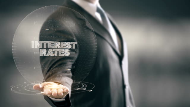 Interest-Rates-with-hologram-businessman-concept