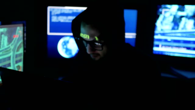 Hacker-tries-to-enter-the-system-using-codes-and-numbers-find-out-security-password,-hacker-enters-software-to-steal-login-information,-IT-professional