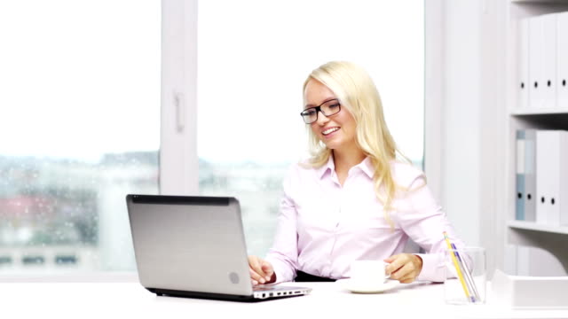woman-secretary-or-student-with-laptop-and-coffee-in-office