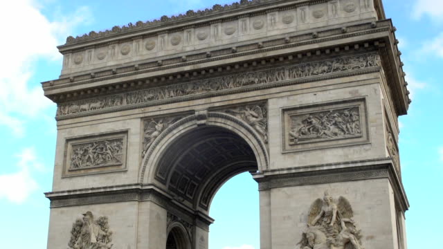 National-French-symbol-Arc-de-Triomphe-against-blue-sky-background,-zoom-out