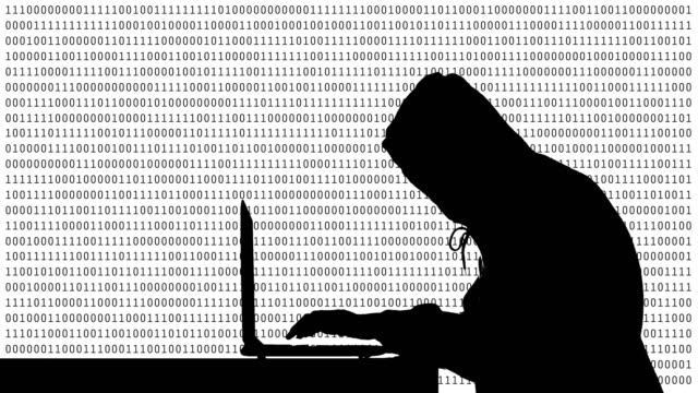 Hacker,-die-Eingabe-auf-einem-Laptop-mit-01-oder-binäre-Zahlen-auf-dem-Computerbildschirm-auf-Monitor-Hintergrund-Matrix,-digitale-Datencode-Technologie-Sicherheitskonzept.-Menschliche-Gestalt-abstrakte-Abbildung