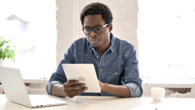 African-Man-Using-Tablet