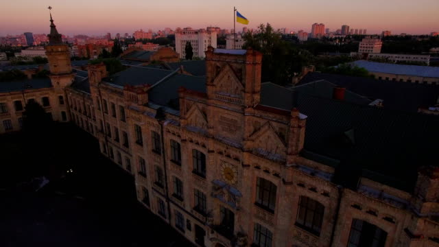 Old-university-on-the-background-of-the-city-at-sunset-aerial