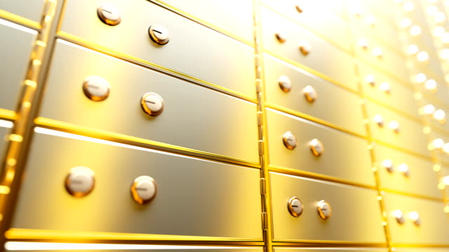 Golden-safe-deposit-boxes-in-a-bright-bank-vault-room