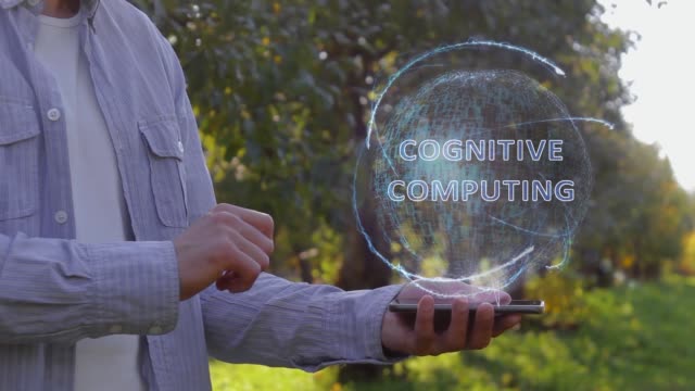 Man-shows-hologram-with-text-Cognitive-computing