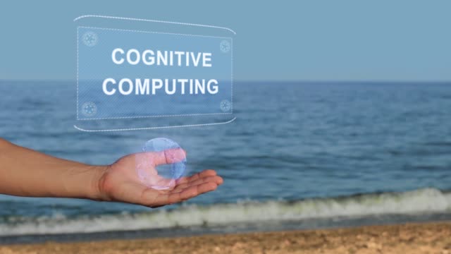 Manos-en-Beach-Hold-holograma-texto-Cognitive-Computing