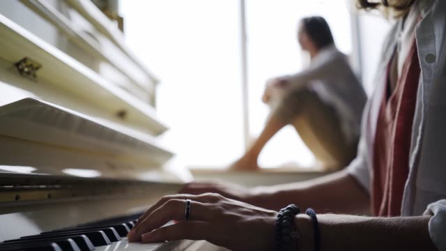 Girlfriends-playing-on-piano