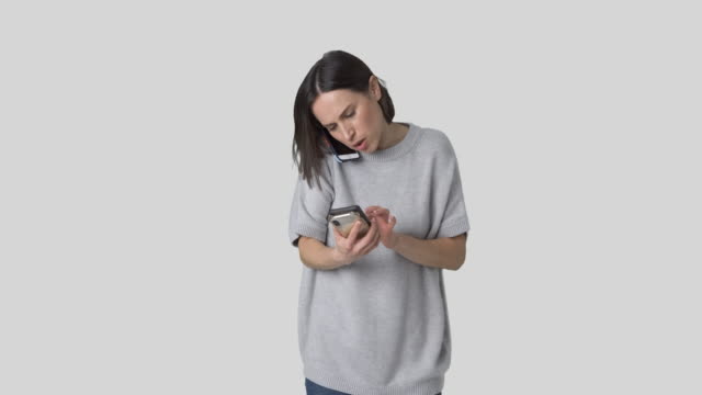 Woman-tired-of-using-three-different-mobile-phones