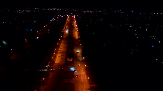 Aerial-view-of-the-city-streets.-Timelapse-of-the-night-city