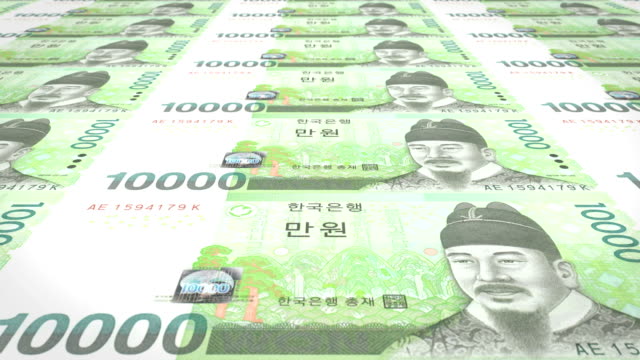 Series-of-banknotes-of-ten-thousand-wons-of-the-bank-of-the-South-Korea-rolling-on-screen,-coins-of-the-world,-cash-money,-loop