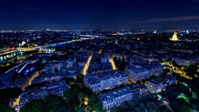 Aerial-Night-timelapse-view-of-Paris-City-and-Seine-river-shot-on-the-top-of-Eiffel-Tower