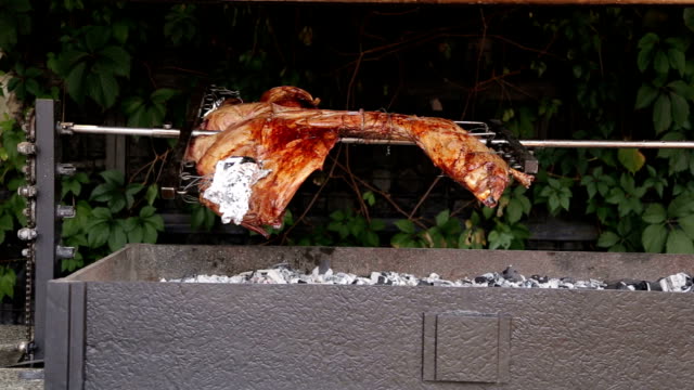 The-meat-is-fried-on-a-grill-on-a-spit.
