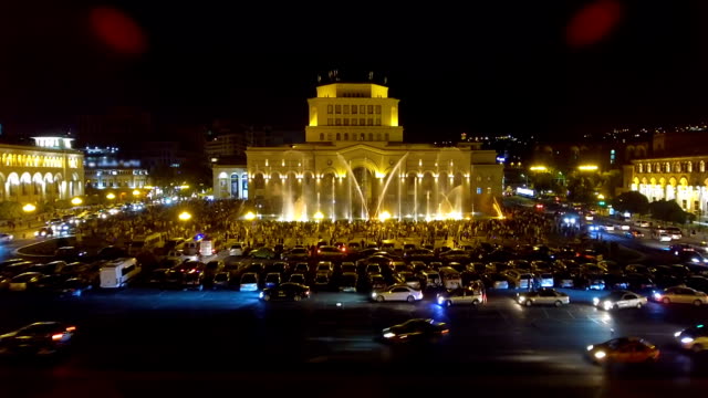 Hundreds-of-people-walking-around-Republic-Square-looking-at-beauty-of-fountains