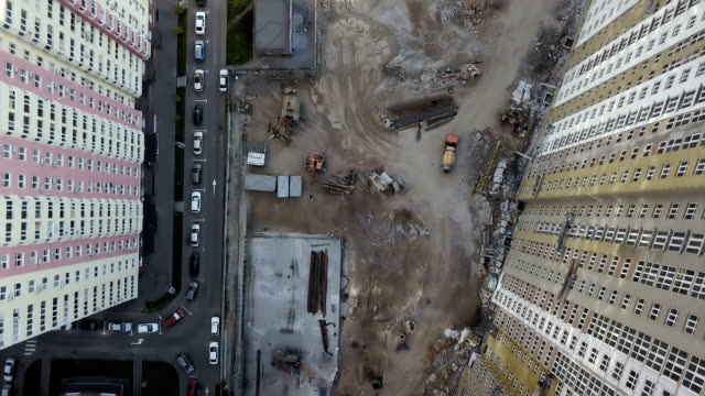 Aerial-view.-Urban-area-in-the-metropolis.-Construction-of-high-rise-residential-apartments-in-the-city.-View-of-the-building-site-from-above.-Sale-and-rental-of-residential-property