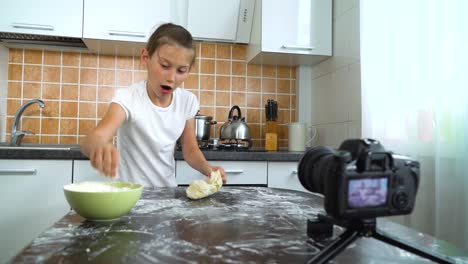Young-vlogger-recording-video-content-for-food-blog-kneading-dough