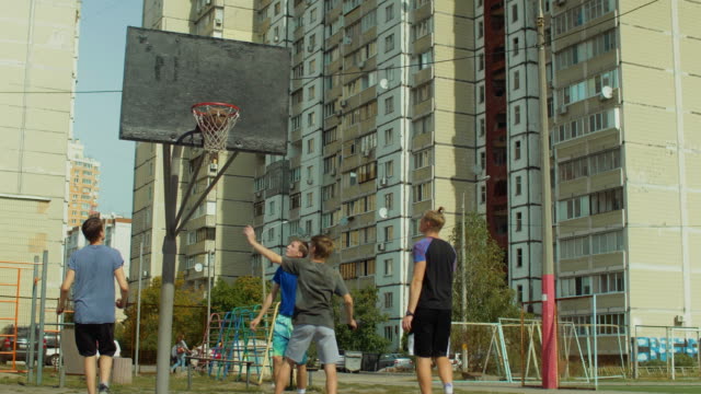 Teenage-streetball-players-in-action-outdoors