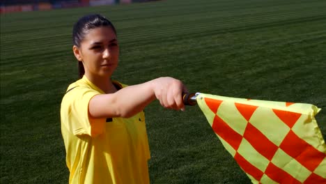 Assistant-female-referee-moving-along-the-sideline-during-a-soccer-match