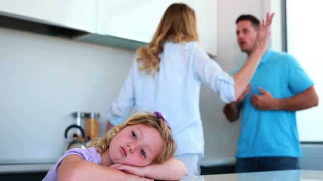 Parents-arguing-behind-their-sad-daughter