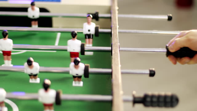 4K-People-playing-table-football.