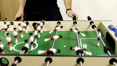Men-playing-table-soccer.