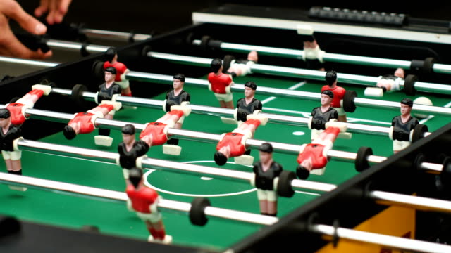 Guys-playing-table-football-50-fps