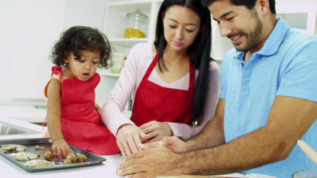 Asian-Chinese-parents-pre-school-daughter-kitchen-baking