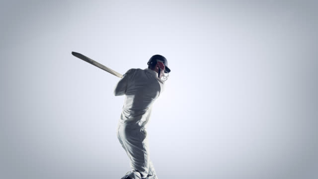 Jugador-de-Cricket-en-acción-sobre-fondo-blanco