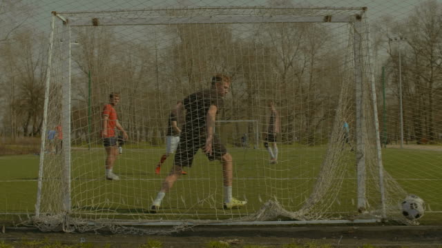 Striker-scoring-a-goal-during-training-match