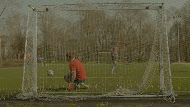 Young-goalkeeper-making-save-after-penalty-kick