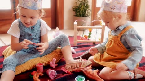 Little-girls-having-fun-playing-with-play-dough-at-home