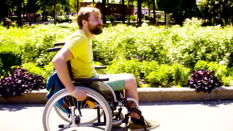 Young-disable-man-in-wheelchair-in-the-park