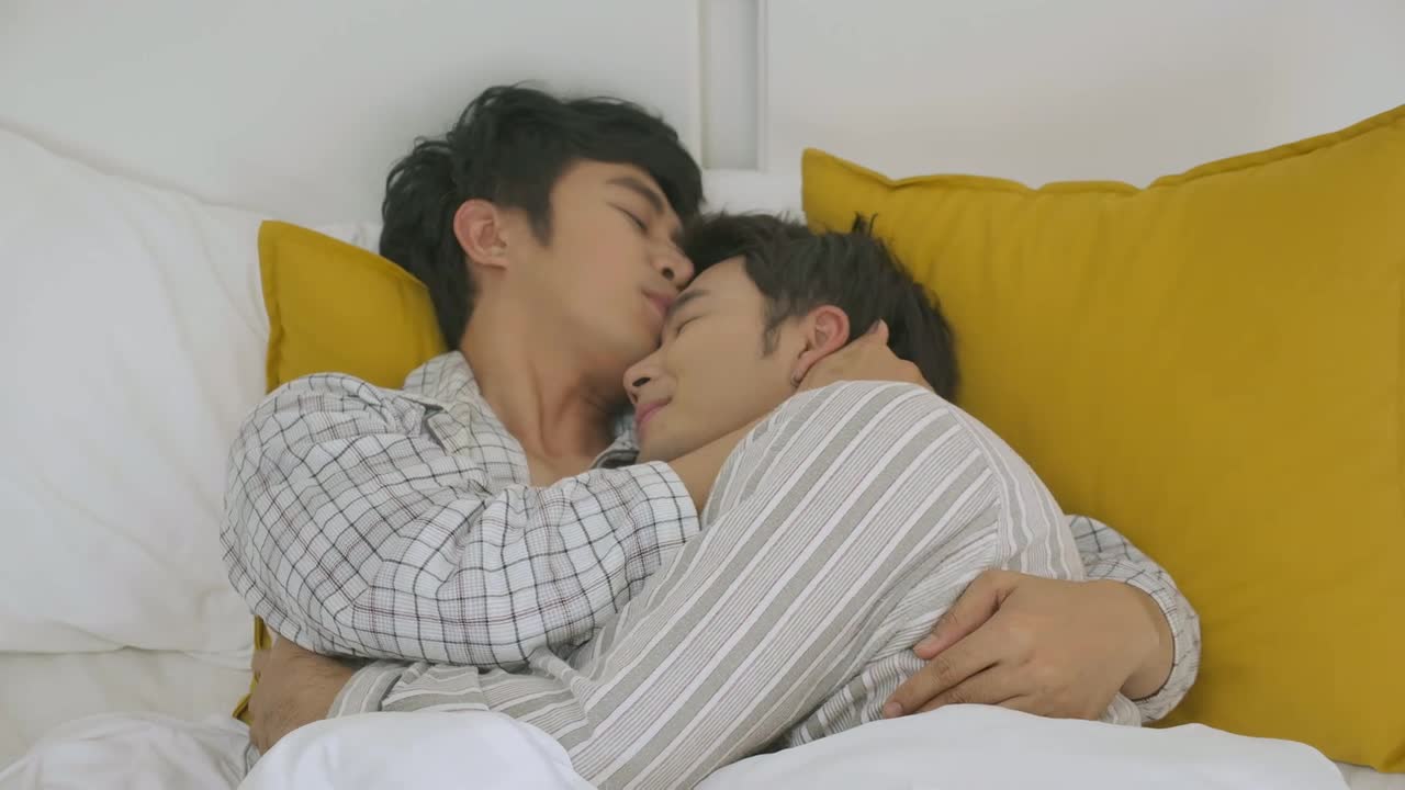 Young Asian Gay Couple Enjoy Love Moment While Lying On Bed When Relaxed. Lifestyle LGBT Couple Together Indoors Concept. Free Stock Video Footage Download Clips People 