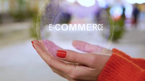 Female-hands-holding-a-conceptual-hologram-E-commerce