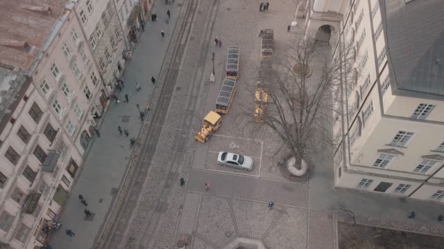 Aerial-City-Lviv,-Ukraine.-European-City.-Tourist-tram-rides-down-city-center