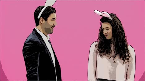 Young-creative-couple-on-pink-background.-With-hackneyed-ears-on-the-head.-During-this-man-gives-a-soft-toy-with-a-hare-to-his-wife.-Embracing-a-girl-looking-into-the-camera-and-showing-a-gesture-class.-Easter.-Animation.